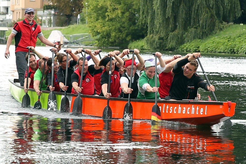 People in a boat rowing